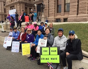 a group of women near the front steps of the Capitol building